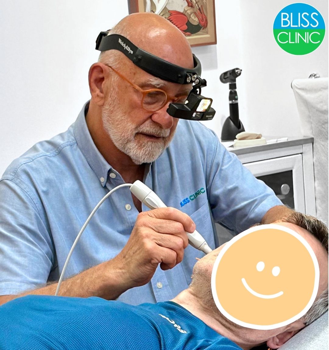 Dr. Bliss treats using a frequency detecting instrument: